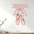 Pink pointe shoe wall sign displayed on a light paneled wall in an elegant room