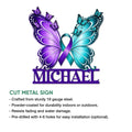 Cut metal suicide awareness sign featuring colorful butterflies and a teal and purple prevention ribbon