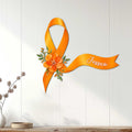 Orange MS awareness ribbon wall sign with flowers displayed on a light wood interior wall