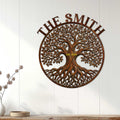 Tree of Life metal wall decor displayed on a white paneled wall in a warm home interior