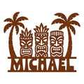 Tiki bar metal sign with three carved tiki masks framed by tropical palm trees