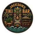 Custom tiki bar metal sign featuring a colorful carved mask, palm trees, tropical bar, and ocean waves
