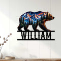 Bear mountain wall sign displayed on a light wood-paneled wall in a rustic home setting