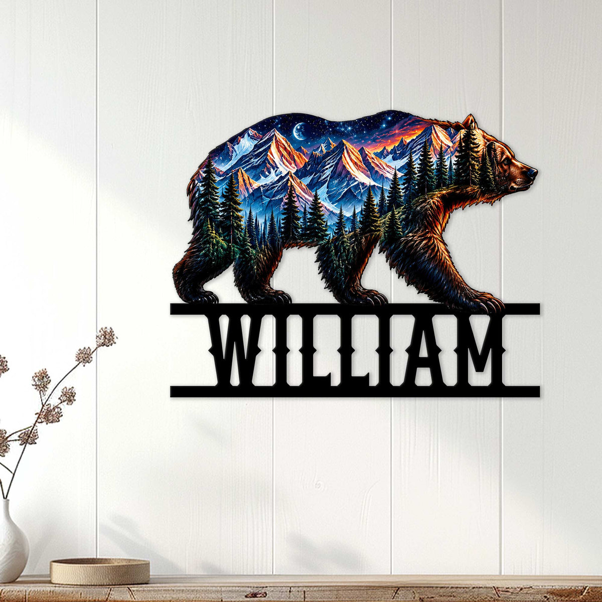 Bear mountain wall sign displayed on a light wood-paneled wall in a rustic home setting