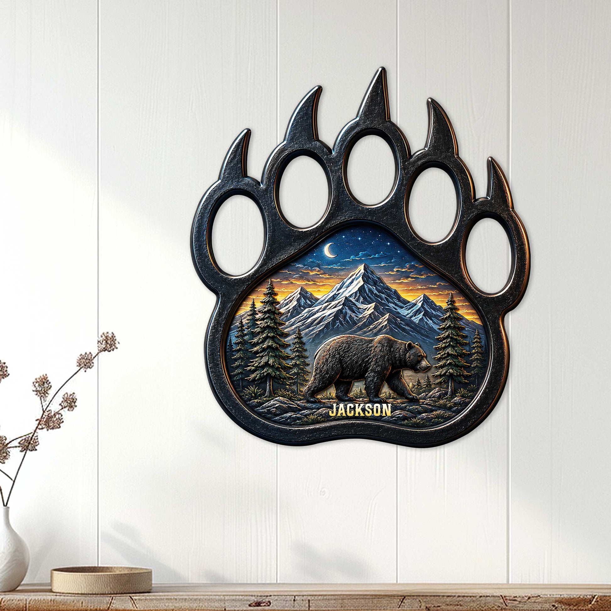 Bear paw wall sign displayed on a light wood-paneled wall as rustic nature decor