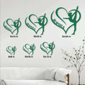 Green heart-shaped gymnast metal signs shown in multiple sizes above a living room sofa