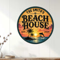 Round beach house wall sign displayed on white paneling in a bright coastal living space