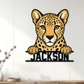 Cheetah metal wall sign displayed on white paneled decor in a bright living room