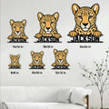 Cheetah metal sign size guide showing multiple scale options styled above a living room sofa