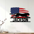 Patriotic cheetah metal sign displayed as bold wall decor on a light wood-paneled wall