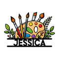 Custom artist metal sign featuring a colorful painter’s palette, brushes, and leafy botanical accents
