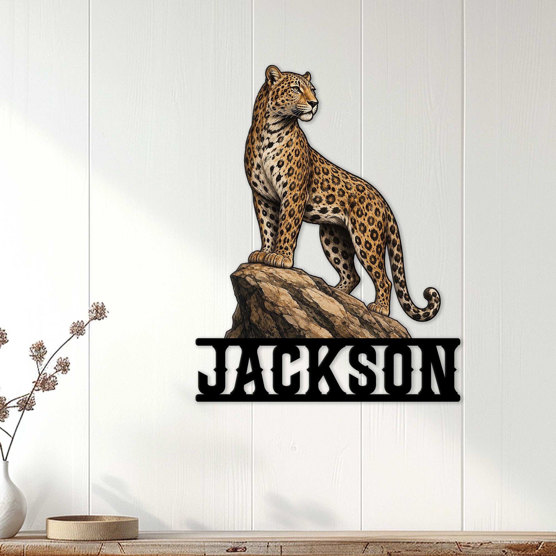 Leopard metal wall decor displayed on a white paneled wall above a console