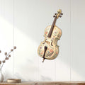 Floral cello wall sign displayed on a light paneled wall in a soft home decor setting