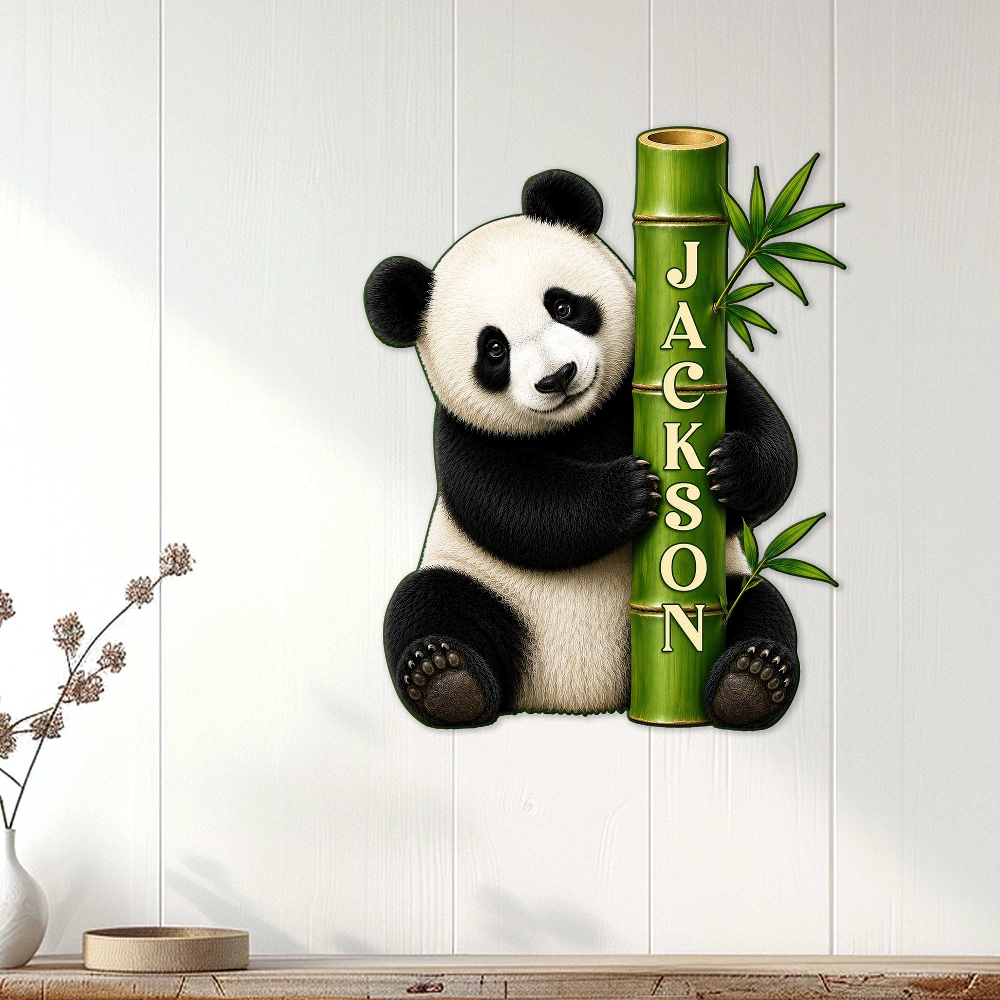 Panda wall sign displayed on a light wood-paneled wall in a welcoming home interior