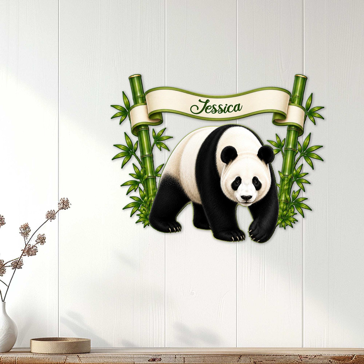 Bamboo panda metal wall art displayed on a light wood-paneled wall in a cozy home setting
