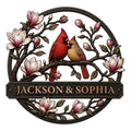 Custom cardinal metal sign featuring a pair of red cardinals perched among blooming magnolia branches