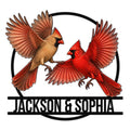 Custom cardinal couple metal sign featuring two colorful cardinals with wings spread inside a circular frame