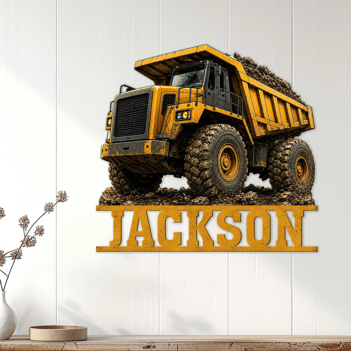 Yellow dump truck wall sign displayed as construction-themed decor on a light wood-paneled wall
