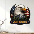 Patriotic eagle wall sign displayed on a white paneled wall above a console table