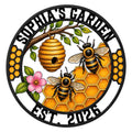 Custom bee metal sign featuring honeybees, a wooden hive, honeycomb, green leaves, and a pink flower