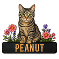 Detailed tabby cat metal sign featuring a striped cat surrounded by colorful pink and purple flowers