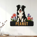 Border Collie metal wall sign displayed on a white paneled wall with bright floral accents