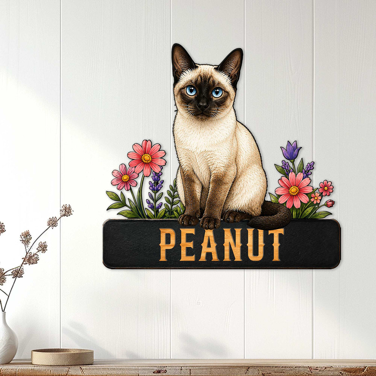 Siamese cat floral metal sign displayed as wall decor in a bright, modern home interior