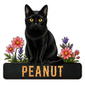 Black cat metal sign with bright golden eyes, colorful flowers, and a bold decorative base