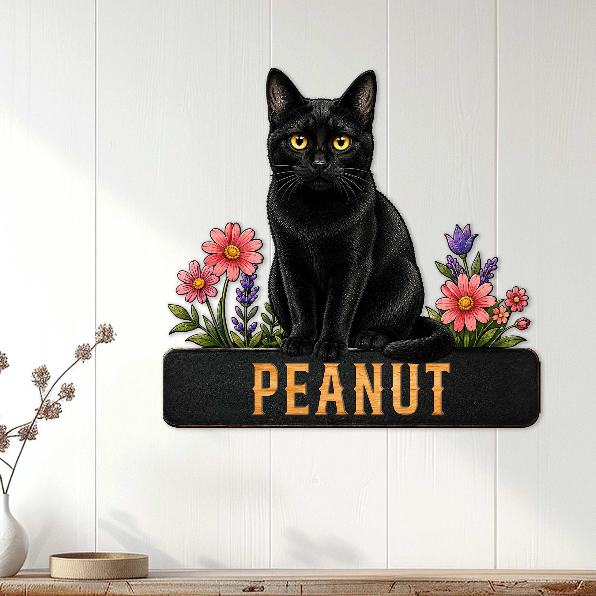 Floral black cat wall sign displayed on a light paneled wall as home decor
