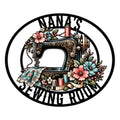 Floral vintage sewing machine metal sign with thread spools, fabric, measuring tape, and sewing room lettering