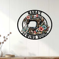 Sewing machine wall sign displayed on white paneling as cozy sewing room decor