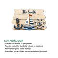Nautical cut metal sign featuring a sailboat, anchor, ship wheel, ocean wave, and coastal-inspired design
