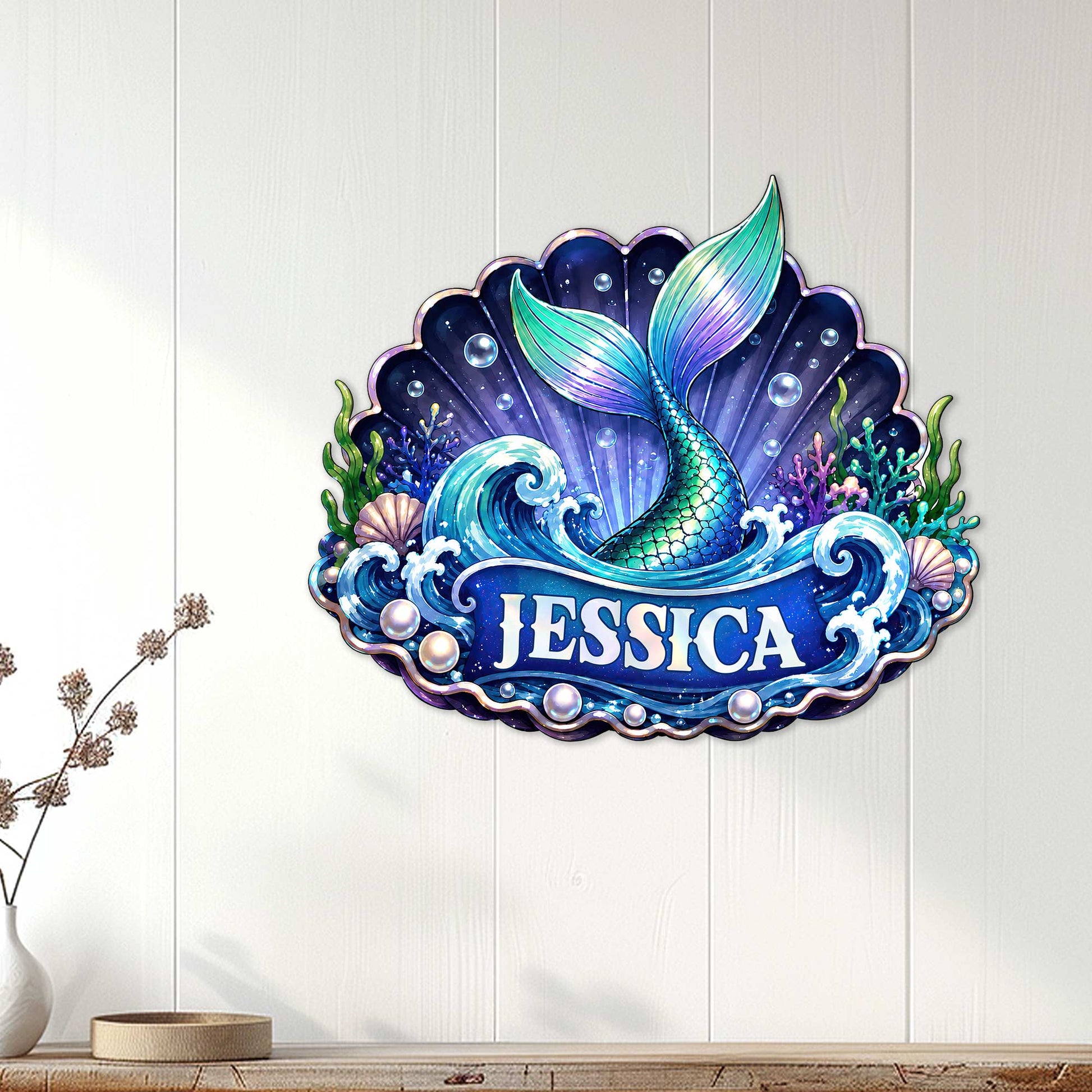 Mermaid ocean wall decor displayed on a light wood wall above a console table in a coastal room