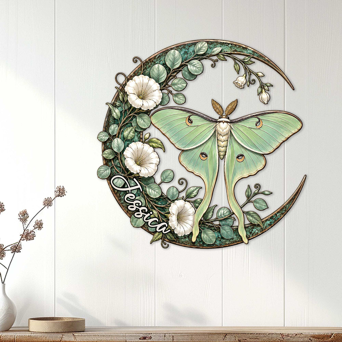 Luna moth wall decor displayed on a light paneled wall above a console table