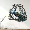 Decorative peacock metal wall sign displayed on a white paneled wall in a bright home interior