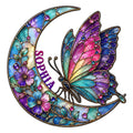 Colorful butterfly metal sign with floral wings nestled inside a crescent moon design