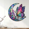 Colorful butterfly wall sign displayed on a light wood-paneled wall in a home decor setting