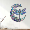 Colorful dragonfly moon wall decor displayed on a light paneled wall above a console table