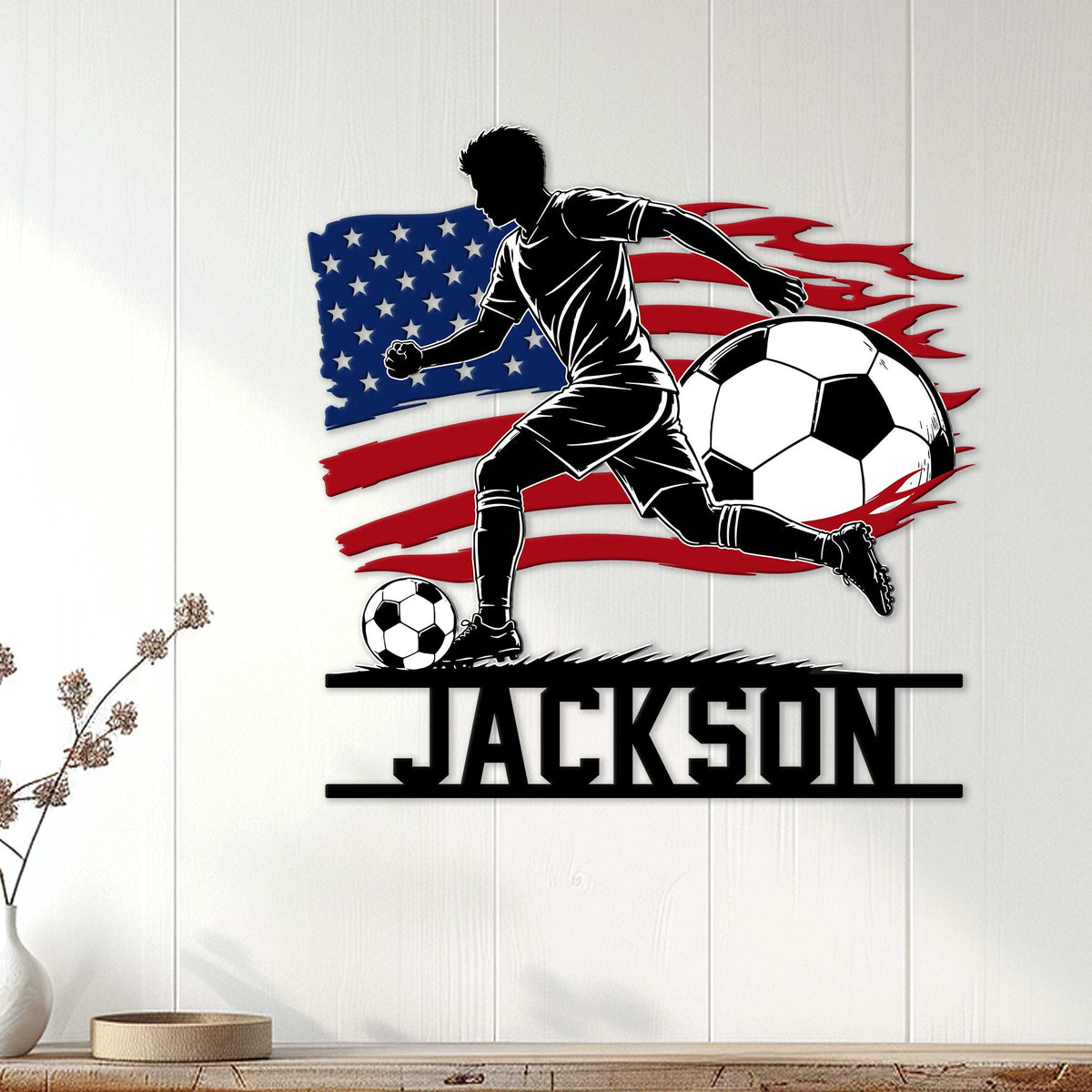 Soccer wall decor displayed on a white paneled wall, featuring a striking player silhouette and flag design