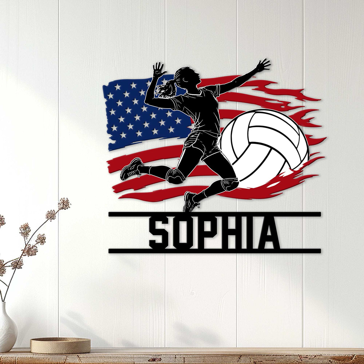 Patriotic volleyball wall decor displayed on a white wood wall, featuring a diving player silhouette and large ball