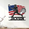 Patriotic lacrosse wall sign displayed on a light paneled wall above a console table