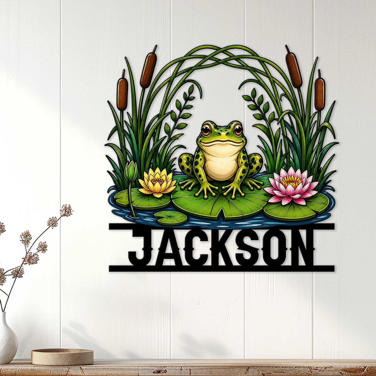 Frog pond wall decor displayed on a light wood-paneled wall in a cozy room