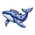 Ornate blue whale metal sign featuring floral folk-art patterns, detailed fins, and a decorative tail