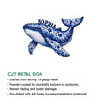 Blue floral whale metal sign shown with a cut-metal design and decorative ocean-inspired artwork