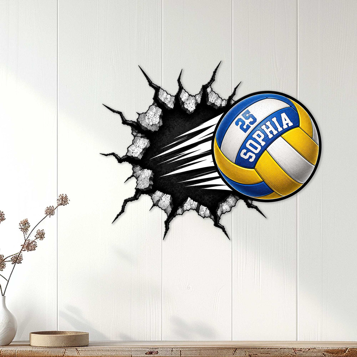 Volleyball metal wall decor displayed on white paneling in a bright home interior