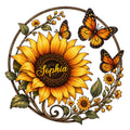 Sunflower metal sign with orange butterflies, leafy vines, and a circular botanical design