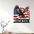 Patriotic eagle wall sign displayed on a light wood-paneled living room wall