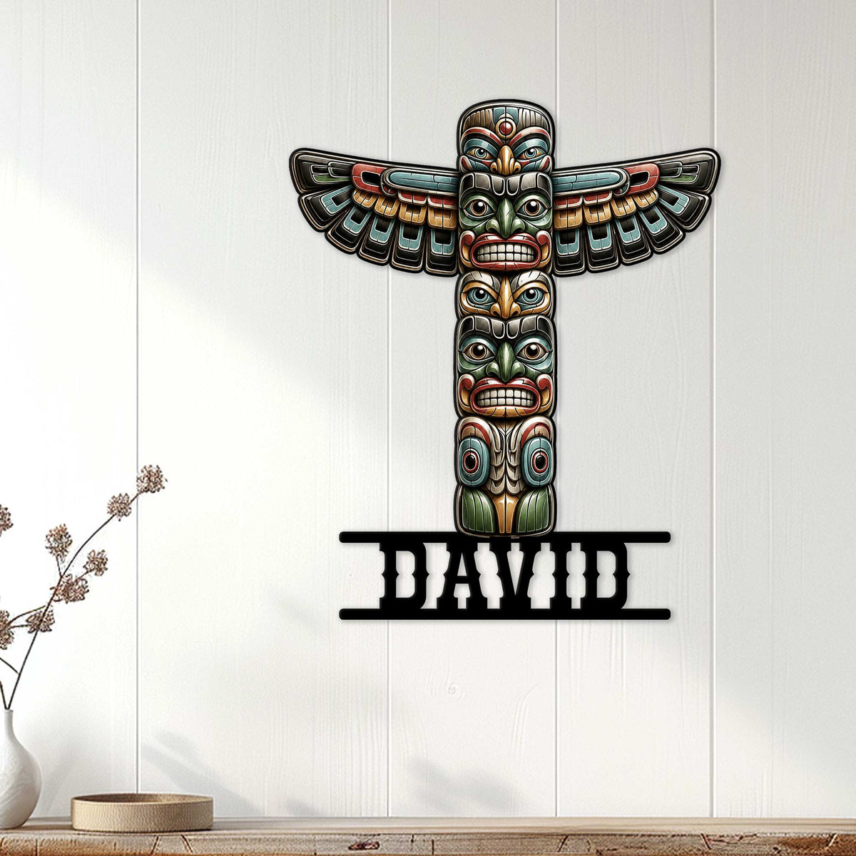 Native-inspired totem pole wall sign displayed on a light wood-paneled wall in a modern living space