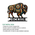 Decorative cut metal bison sign featuring bold Southwestern colors and symbolic geometric artwork
