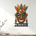 Native American-inspired tribal mask metal sign displayed as colorful wall decor in a bright modern room